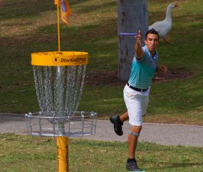Throwing a Disc at Disc Golf Net